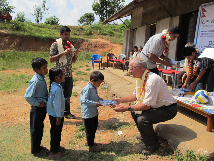 2_A student of Shree Kalika School receiving the stationery from a British friend