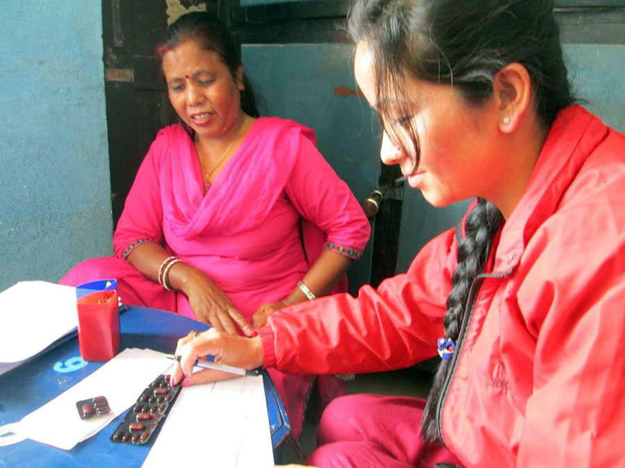 4_Kamala coordinating with a teacher for distributing medicines