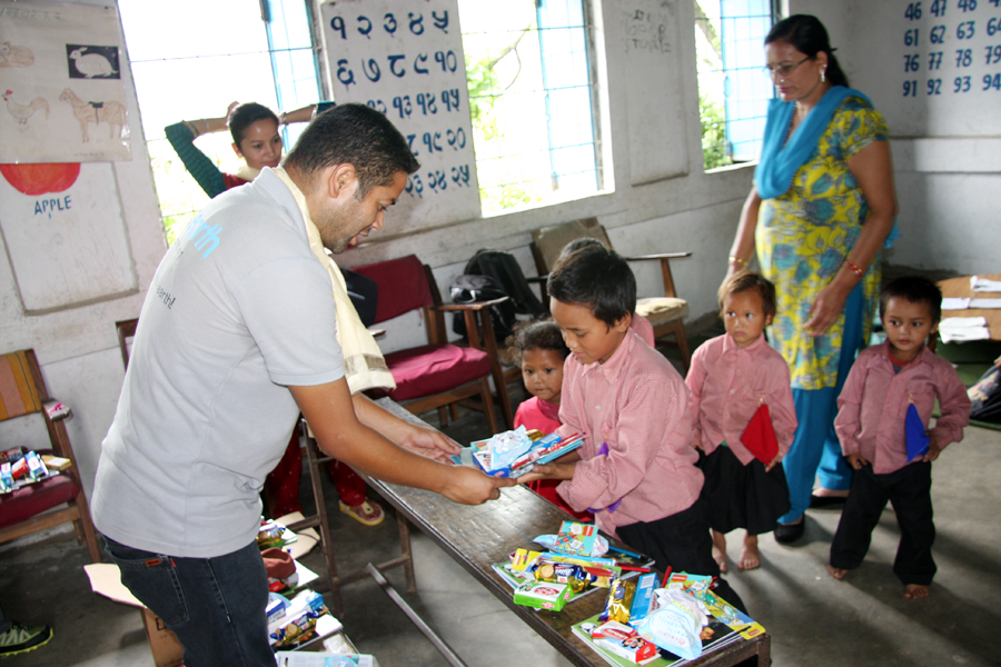 2_President Koirala distributing educational and hygienic materials