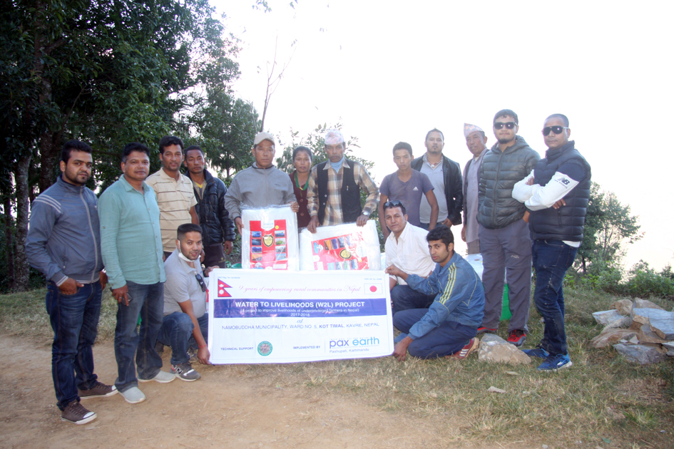 Photo 6 Group photo after distributing drip irrigation kits and silpaulins to beneficiary farmers in Kot Timal